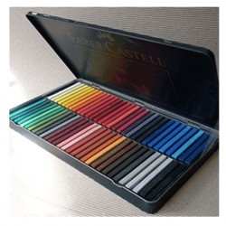 Caja pasteles Polychromos Faber Castell en caja de metal.